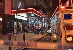 Police officers and paramedics at Irving Plaza, a Manhattan music hall, after a shooting during a rap concert on May 25. Photo Credit: Louis Lanzano for The New York Times